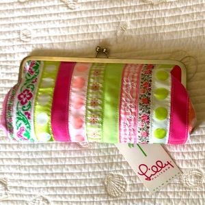Lilly Pulitzer clutch. Colorful ribbon bands with pink solid lining.